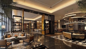 A spacious lobby with a central bar, seating areas, and a large open space with a patterned floor. - voco Beijing Temple of Heaven by IHG (Beijing)