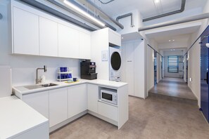 Mini-fridge, microwave, stovetop, cookware/dishes/utensils