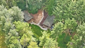 An aerial view of a cabin surrounded by dense forest, with a clear path leading to the entrance. - Safari Tent sleeps 6 Pet Friendly (Hayle)