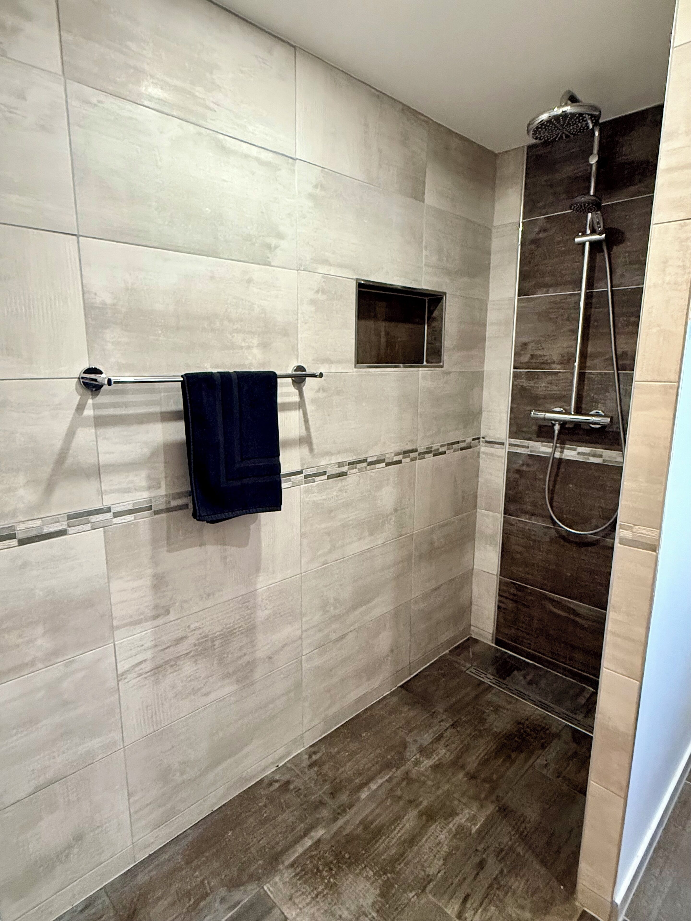 Shower, hair dryer, towels, toilet paper