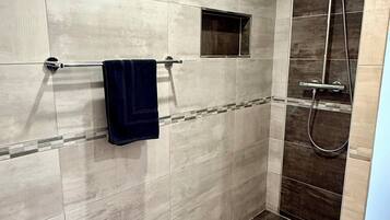 Shower, hair dryer, towels, toilet paper
