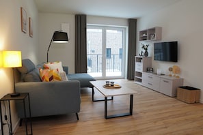 TV - Küste33/8 - North Sea time on the dyke. Sauna. Beach chair. Balcony. (Tossens)