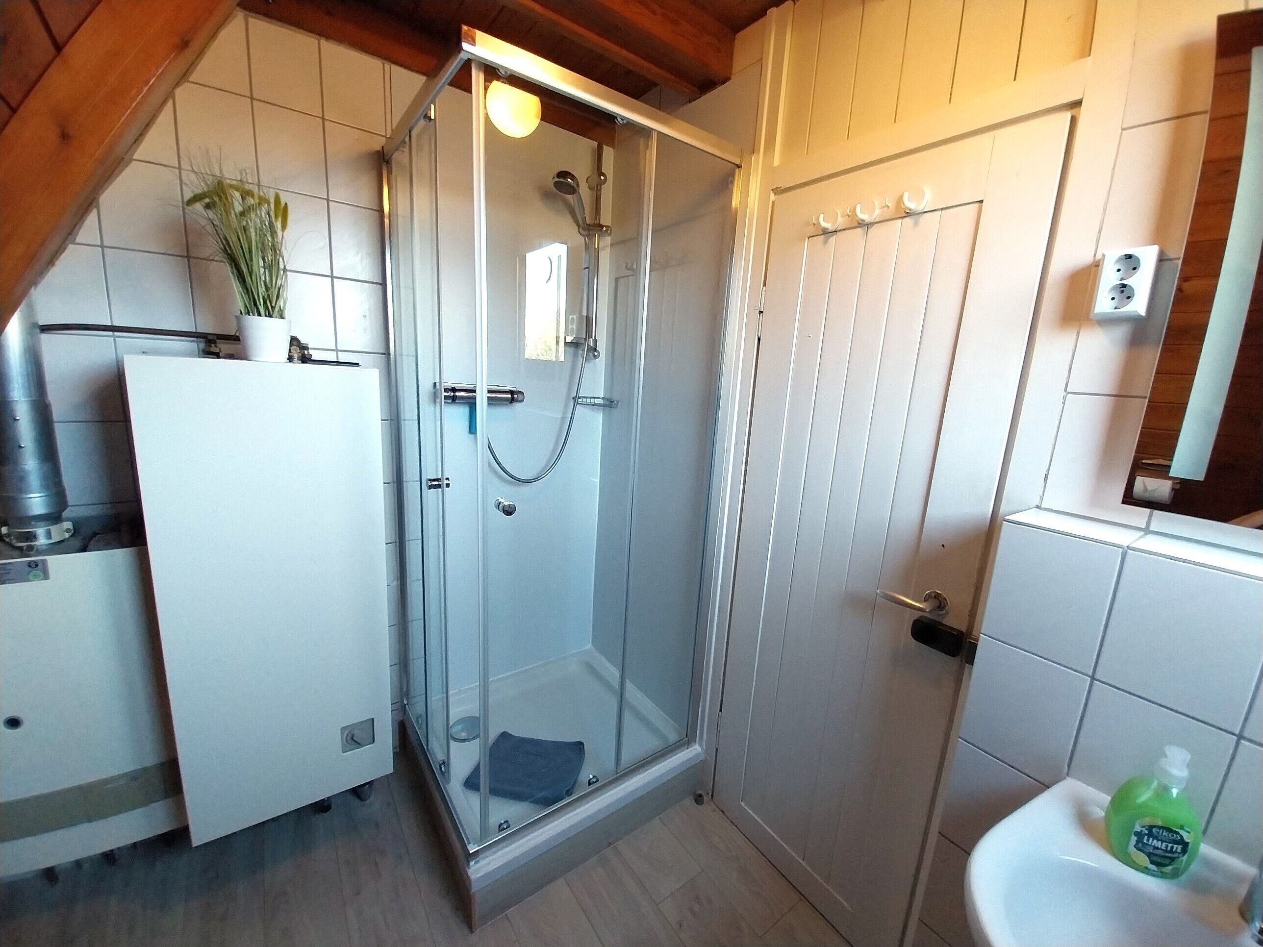 Shower, hair dryer, towels, toilet paper