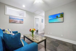 TV - A boutique, renovated coastal retreat featuring fully equipped condos w/kitchen, minutes walking to the beach & restaurants, exciting amenities like a heated pool, BBQ Grill, hammock and fun yard games. Centrally located, minutes to Pompano Beach! (Pompano Beach)