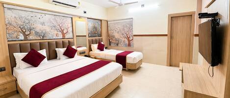 Deluxe Triple Room, City View | Desk, laptop workspace, free WiFi