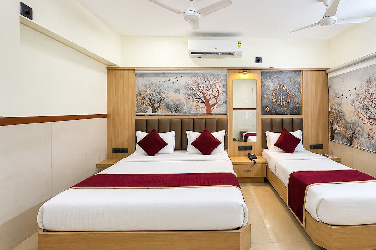 Deluxe Triple Room, City View | Desk, laptop workspace, free WiFi