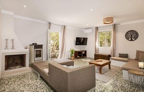 TV, fireplace - Stunning home in Ses Salines with house a panoramic view (Ses Salines)