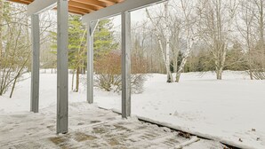 A snow-covered outdoor area with a wooden pergola structure. - 3 Mi to Windham Mountain: Pet-friendly Apt w/ Yard (Hensonville)