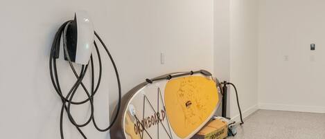 A white wall with a white device and a yellow object with 'ORCHIBOARD' text.