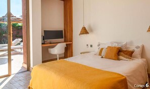 A bedroom with a bed, a desk, a chair, and a television. - Villa Zen'O | Palmeraie view | Heated swimming pool (Marrakech)