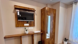 A modern bathroom with a wooden vanity, a mirror, a sink, and a toilet. - Namaste Hostel Rishikesh (Rishikesh)