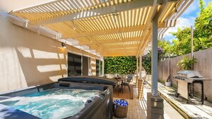 A hot tub, patio furniture, and a grill under a pergola. - Amazing Reviews W/Jacuzzi, Walk 2 Beach, Lrg Yard! (San Diego)