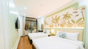 A hotel room with two beds, a TV, a sliding door, and a tropical-themed wall mural. - OCEAN HOTEL NINH BINH (Hoa Lu)