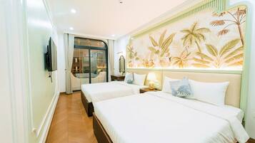 Family Room, Balcony, City View | Free minibar items, desk, laptop workspace, blackout drapes