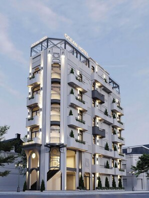A multi-story hotel with balconies, a staircase, and a sign reading 'OCEAN HOTEL'. - OCEAN HOTEL NINH BINH (Hoa Lu)