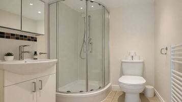 Combined shower/bathtub, deep-soaking bathtub, hair dryer, towels