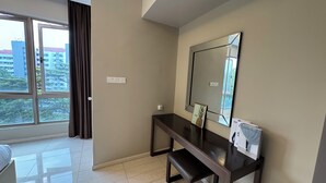A modern hotel room with a large window, a dark wooden desk, a mirror, and a bed. - Dorsett Hartamas|KL City|Rooftop Pool|Bathtub|1KM from 1Mont Kiara|8KM from KLCC (Kuala Lumpur)
