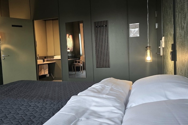 Double Room, 1 King Bed, City View, Private bathroom/shared shower | Desk, laptop workspace, blackout curtains, bed sheets