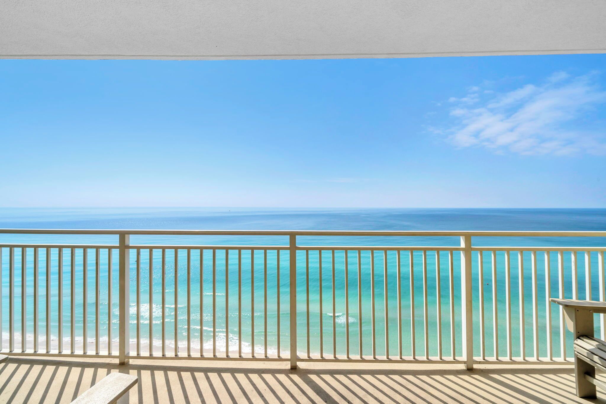 A balcony with a view of the ocean.