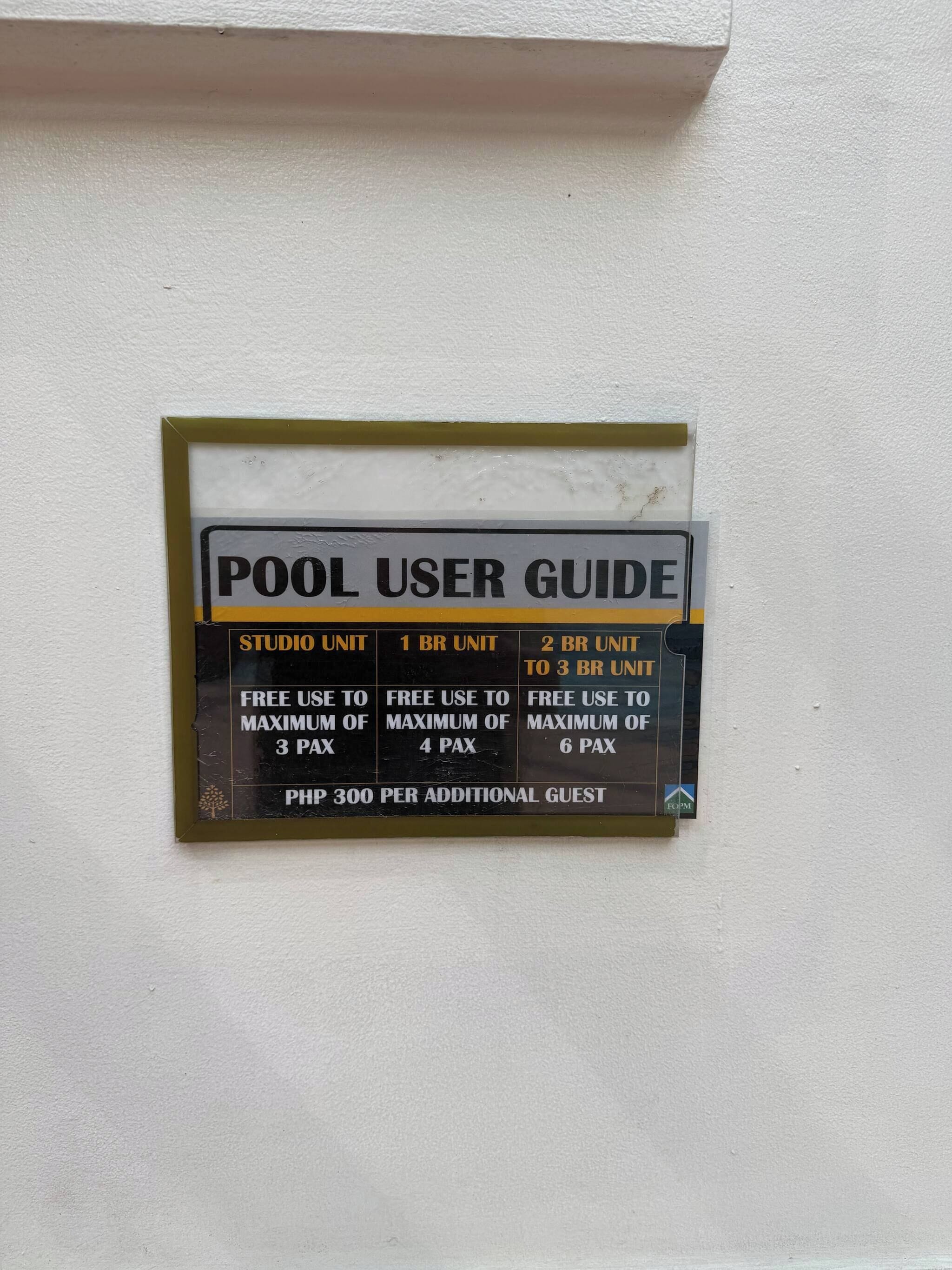 A pool user guide sign with information on different pool unit sizes and their respective free use limits.