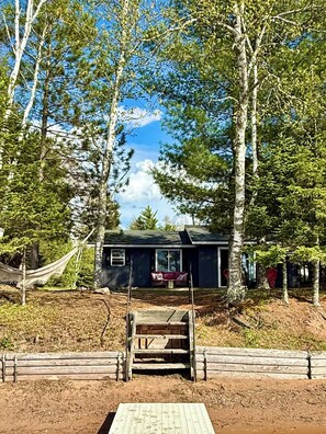 Exterior - Charming Lakefront Cabin. 100 ft private beach with dock on Lake of the Falls. (Mercer)