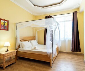 Minibar, desk, laptop workspace, iron/ironing board