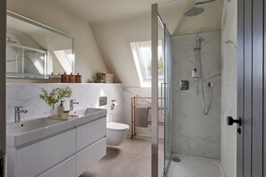 Shower, hair dryer, towels, soap