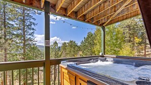 A hot tub on a wooden deck with a view of a forest. - Hot Tub - Near Eldora - Views - Pool Table (Rollinsville)