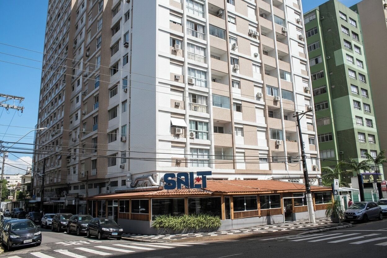 A multi-story building with a restaurant named "SALT" on the ground floor.