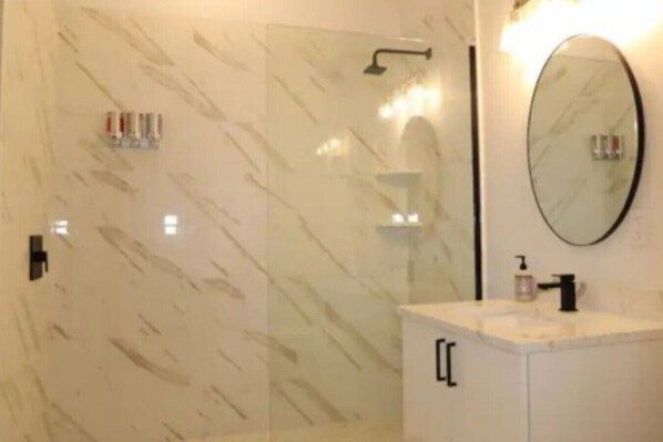 Shower, hair dryer, towels, soap