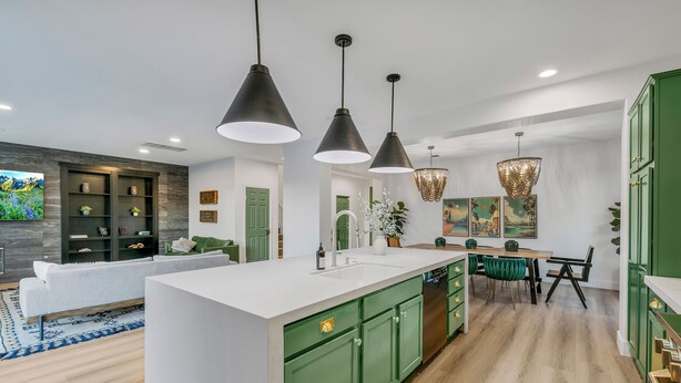 A modern kitchen with a central island, green cabinets, and pendant lighting. - The Headliner:Private! Game Room! Festivals! (Coachella)