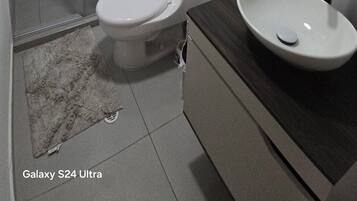 Shower, towels, soap, toilet paper