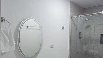 Shower, towels, soap, toilet paper