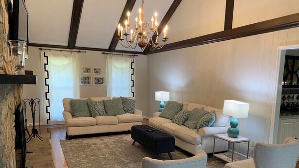 A living room with two sofas, a coffee table, and two lamps. - Available Masters! Only 2.2 miles from the course. (Augusta)