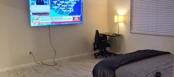 A cozy place with a wheelchair accessible shower and adjustable beds