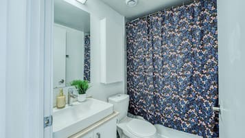 Exclusive Suite, 1 Queen Bed, Non Smoking | Bathroom | Free toiletries, hair dryer, towels, soap