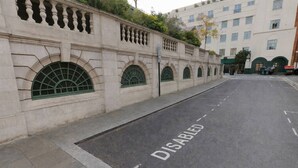 A street with a disabled parking space marked on the road. - Heart of London Signature Stay | Sleeps 6 (Greater London)