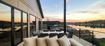 Luxe Port Lookout with waterfront with dock, theater, game room, and huge deck