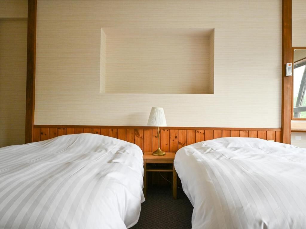 Kahden hengen deluxe-huone (kaksi sänkyä), vuoristonäköala | Tallelokero huoneessa, ilmainen Wi-Fi