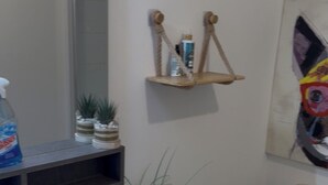 A bathroom with a white sink, dark cabinets, a wooden toilet, and a mirror. - 2. "Comfortable stay in Bagnolet - Ideally located near the Metro" (Bagnolet)