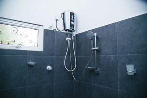 Shower, hair dryer, slippers, towels