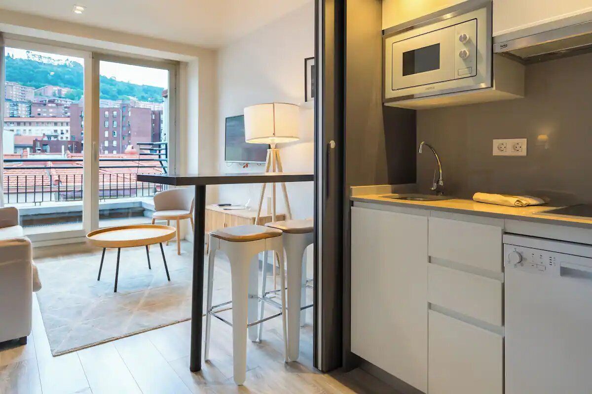 Step inside and unwind with balcony views and sleek kitchenette.