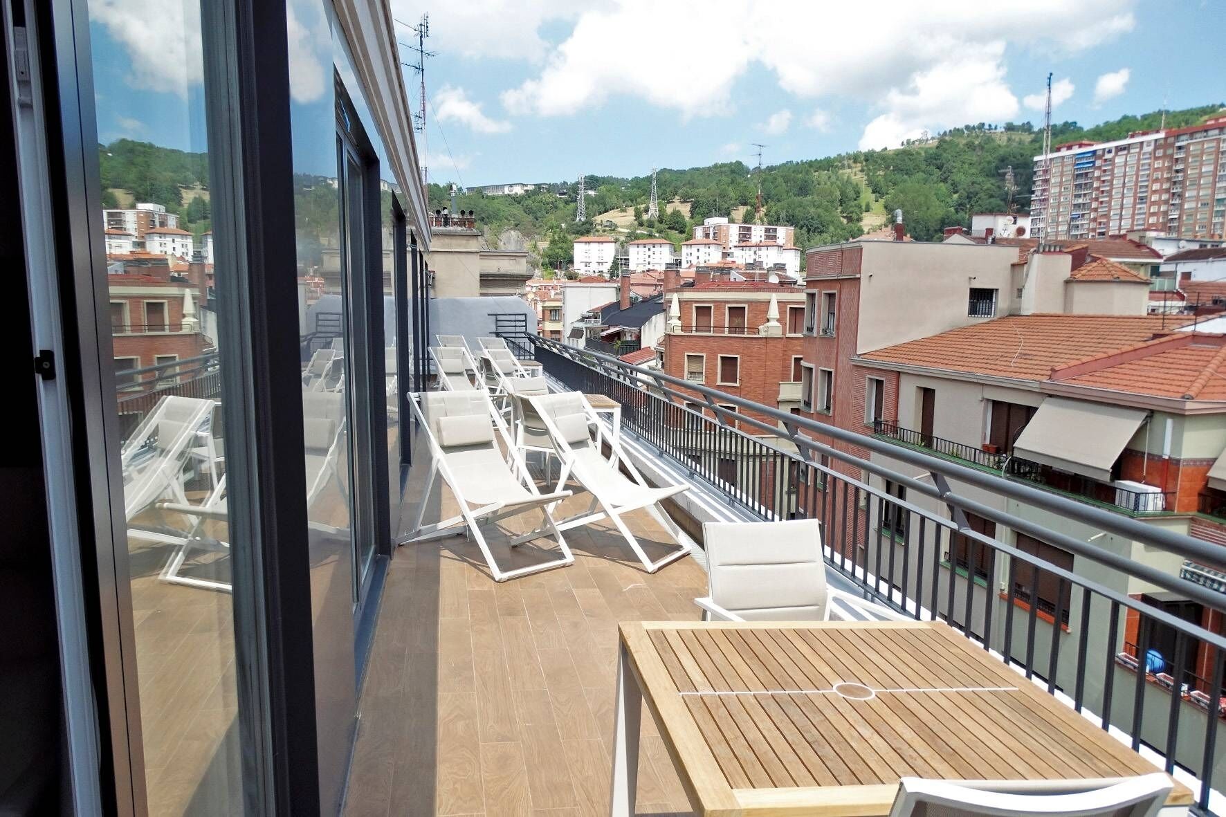 Breathe in panoramic views while sharing drinks on the balcony.