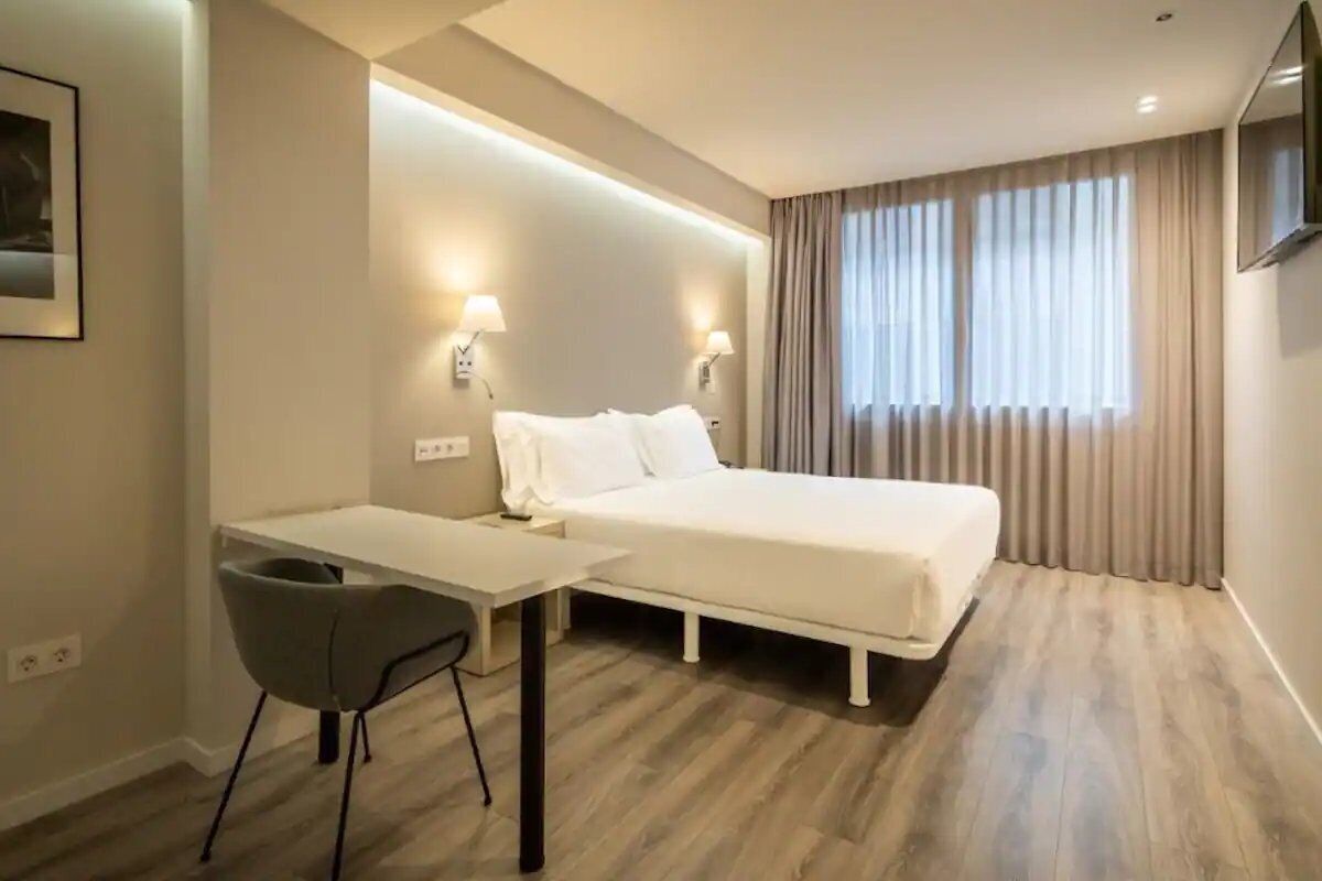 Start your day refreshed in this serene, minimalist sleeping space.