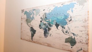 A world map on a wall. - Budget 1BR for 2 Guests in Pavonia (Jersey City)
