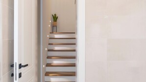 A modern interior with a staircase leading to a landing. - Beautiful Villa for 6 Near Zadar Beach (Zadar)