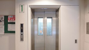 An elevator with a control panel and a door number 1. - b&Kuromon 3 (Osaka)