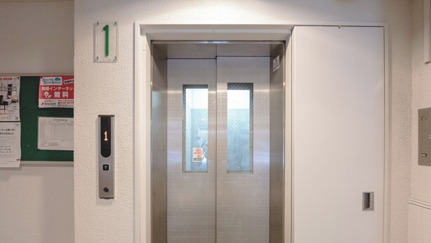 An elevator with a control panel and a door number 1. - b&Kuromon 3 (Osaka)