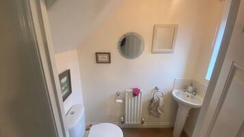 Shower, hair dryer, towels, toilet paper