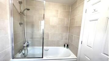 Shower, hair dryer, towels, toilet paper